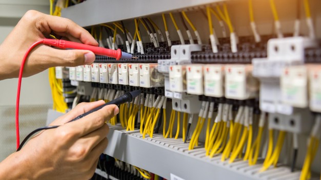 A commercial electrician working on a commercial site